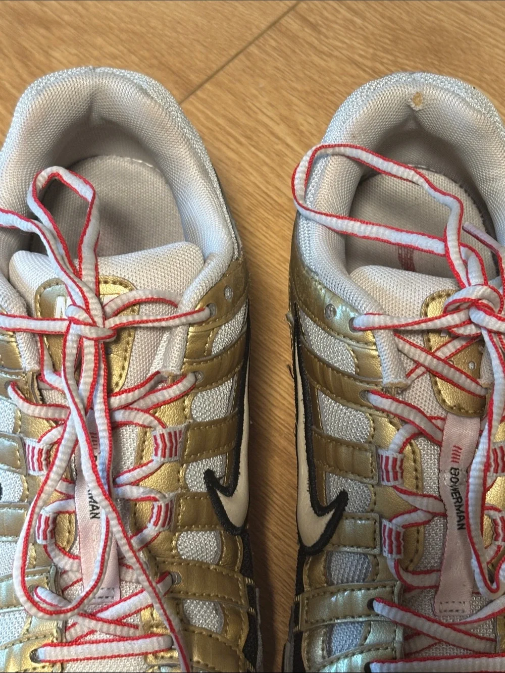 Nike BOWERMAN Metallic Gold, White & Black Athletic Sneakers with Red Details